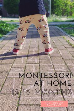 a young child standing on top of a brick sidewalk with the words montessori at home