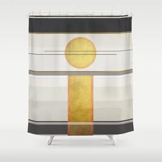 a shower curtain with an abstract design in gold and greys on the bottom half