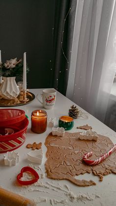 a table topped with lots of different types of cookies and other items on top of it