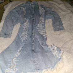 This Is A Lightweight Distressed Denim Jacket/ Dress. The Front Top And Bottom Have A Ripped Design. The Back Has The Same Ripped Design. The Front Has A Snap Button All The Way Up And Down. The Sleeves Snap Shut At The Ends With A Keyhole Design. Never Worn. Would Be Cute With A Belt And Boots Or Like A Jacket With Sneakers Cute Many Ways. Accepting Fair Offers. I Offers. 18 Inch Long Snap Shut Sleeves 24 In Hes Across The Bottom 26 Inches Across At The Middle 28 Inches From Pit To Pit 43 Inche Light Wash Long Sleeve Denim Dress, Trendy Light Wash Long Sleeve Denim Dress, Trendy Long Sleeve Light Wash Denim Dress, Distressed Medium Wash Denim Dress, Denim Dress With Frayed Hem For Fall, Light Wash Denim Dress With Frayed Hem For Fall, Fall Light Wash Denim Dress With Frayed Hem, Spring Distressed Denim Dress, Distressed Medium Wash Cotton Denim Dress