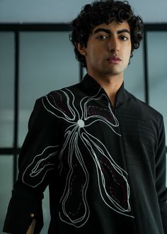 Featuring a black handpainted shirt kurta on a knit base with an abstract flower overlay with grey and wine thread details. Designer Long Sleeve Kurta For Spring, Designer Black Shirt For Spring, Black Cotton Kurta For Spring, Black Long Sleeve Kurta For Spring, Fitted Black Spring Kurta, Black Shirt With Floral Embroidery For Fall, Mango Crepe, Jatin Malik, Flower Overlay