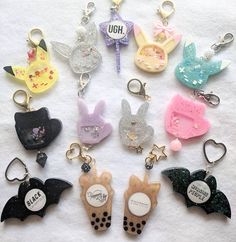 many different shaped key chains on a white surface