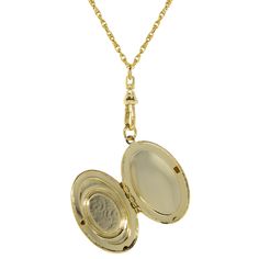 A style popularized by Queen Victoria, this timeless vintage inspired locket necklace features a simulated carnelian and ivory color cameo set on an etched gold tone frame. Adds a beautiful vintage feel to any ensemble. Ornate etched 14k gold dipped locket frame Moveable swivel finding Rope chain necklaces with lobster clasp closure Measurements: 28"L x 2.85"H x 1.07"W 1928 JEWELRY COLLECTION From the vaults of rich European capitals to the antique laden attics of old American estates, 1928 Jewe Vintage Oval Necklace With Coin Pendant, Vintage Oval Jewelry With Coin Pendant, Vintage Oval Link Jewelry With Charms, Heirloom Style Oval Pendant Locket Necklace With Vintage Charm, Oval Cameo Keepsake Jewelry, Victorian Gold Locket Necklace With Vintage Charm, Heirloom Yellow Gold Locket Necklace With Charms, Antique Medallion Locket Necklace, Antique Yellow Gold Medallion Locket Necklace