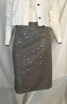 Product Description: This handmade knee-length skirt is perfect for plus-size women who love a touch of sparkle. The skirt is adorned with delicate sequins that add just the right amount of shimmer to any outfit. The elastic waistband ensures a comfortable fit for all body types, while the extended sizes cater to those who have difficulty finding fashionable clothing in their size. This skirt is made with a blend of cotton and polyester, making it durable and easy to care for.  Highlights: - Han Knee-length Sequined Party Bottoms, Sequined Knee-length Bottoms For Night Out, Knee-length Pencil Skirt For Party, Fitted Sequin Pencil Mini Skirt, Fitted Sequin Pencil Skirt For Spring, Spring Fitted Sequin Pencil Skirt, Knee-length Sequined Skirt For Night Out, Spring Sequined Fitted Pencil Skirt, Spring Sequin Pencil Skirt