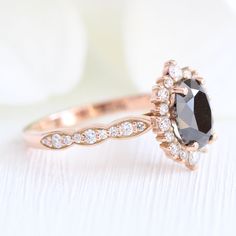 Black Diamond Engagement Ring Rose Gold Cluster Halo Diamond Oval Ring | La More Design Elegant Black Diamond Wedding Ring, Black Oval Diamond Wedding Ring, Oval Black Diamond Wedding Ring, Wedding Black Diamond Ring, Wedding Diamond Ring With Black Diamonds, Black Wedding Dress With Rose Cut Diamonds, Black Diamond Ring With Rose Cut For Wedding, Black Rose Cut Diamond Wedding Ring, Wedding Black Rose Cut Diamond Ring