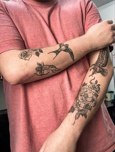 a man with tattoos on his arms and arm