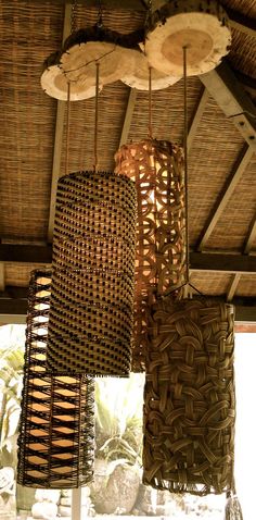 several woven baskets hanging from the ceiling