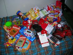 a bed covered in lots of toys and snacks