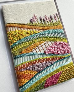 a piece of art that has been made to look like something out of yarn and thread