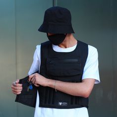 The flak vest for urban conditions is ideal for militarists and those who are chasing the mainstream in search of hype. Such an object of limited collection is rarely found among the crowd and will always emphasize the high status and good taste of its owner. Besides the fact that this poisonous thing will create a unique and unrepeatable style, this tactical vest will serve as an excellent replacement for the pockets on your jacket. Also, this cargo vest can serve as excellent for security pers Flak Vest, Techwear Vest, Combat Vest, Mens Techwear, Urban Tactical, Multi Pocket Vest, Yellow Trench Coat, Goth Shop, Black Duster