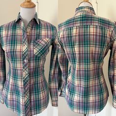 "Cute 80s style madras plaid button up shirt from Mervyn's Hot Line. Made of a lightweight cotton blend. Spread collar  Patch pocket on breast. Long tail. Barrel cuffs. Yoked back. Fitted cut with darts in front and back. Probably late 70s / early 80s.  In very good used condition.  Tagged Mervyns Hot Line Size 9  55/45 cotton poly  Measurements taken flat buttoned Pit to pit 18\" Waist: 16\" Hips: 17\" Sleeve: 30\"  Length shoulder seam to hem: 26\" Mervyns of California  Preppy style Madras pl Plaid Fitted Classic Shirt, Classic Plaid Fitted Shirt, Classic Fitted Plaid Shirt, Fitted Plaid Cotton Shirt, Fitted Plaid Flannel Shirt With Spread Collar, Fall Cotton Fitted Shirt, Fitted Casual Flannel Shirt With Spread Collar, Casual Fitted Flannel Shirt With Spread Collar, Fall Plaid Top With Placket