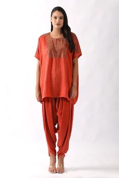 Orange kaftan with embroidered yoke using nalki and moti work. Paired with a dhoti pant. - Aza Fashions Traditional Silk Pant Set With Mirror Work, Traditional Pant Set With Dabka Work For Navratri, Festive Harem Kurta For Navratri, Traditional Designer Pant Set For Navratri, Traditional Dabka Work Pant Set For Navratri, Diwali Rituals Sets With Resham Embroidery, Traditional Tunic Palazzo Set For Navratri, Traditional Sets With Mirror Work On Tunic, Navratri Embroidered Kaftan With Traditional Drape