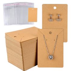 the package includes two necklaces, earrings and an envelope with clear plastic bags on it