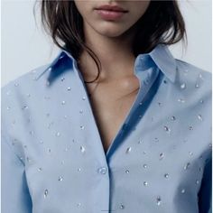 Elevate Your Wardrobe With This Stunning Zara Shirt Top In A Beautiful Blue Hue. The Shirt Features Intricate Rhinestone Accents, Adding A Touch Of Elegance To Your Outfit. The Collared Neckline And Button Closure Make It Perfect For Both Casual And Business Occasions. Crafted From 100% Cotton, The Shirt Is Machine Washable And Has A Regular Fit. It Comes In A Size M, Making It Ideal For Women Who Love Basic Styles With A City And Classic Theme. This Button-Up Shirt Top With Long Casual Sleeves Is Perfect For All Seasons, Whether It's Winter, Summer, Fall, Or Spring. Runs Large Zara Embroidered Top, Sleeveless Peplum Top, Balloon Sleeve Blouse, Polka Dot Shirt, Zara Shirt, Polka Dot Blouse, Classic Theme, Green Blouse, Poplin Shirt