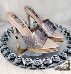 The Zani AB Crystal heels are one of a kind mule heels created with AB crystals rhinestones on a nude surface. The pics you see here does not do the actual shoes justice. 4 inch heels Heels are true to size. Processing takes 3 days to create and 3-4 days for shipping (depending on your location) Luxury Glamorous Heels With 4-inch Heel, Designer Luxury Heels With Rhinestones, Shoes For Women With Crystal Heels, Luxury Elegant Mules With Rhinestones, Luxury Heels With Stone Embellishments For Women, Luxury Heels With Sculpted Heel For Event, Bling Shoes Heels Pumps, Luxury Bedazzled Ankle Strap Heels, Luxury Elegant Heels With Stone Embellishments