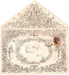 an old envelope with ornate designs on it