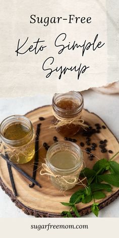 sugar free keto sample syrup on a wooden tray with green leaves and spoons