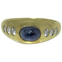 14 karat yellow gypsy style ring Oval cabochon blue sapphire approximately 6mm x 4.5mm x 3.5mm, approximately 1.40 carat, set horizontally 6 round diamonds approximately .36 total diamond weight Stamped "14K" and the Felix B. Vollman jewelry mark Size 8 Sapphire Ring Vintage, Vintage Sapphire Ring, Diamond Dress Ring, Fox Jewelry, Sapphire And Diamond Earrings, Contemporary Engagement Rings, Sapphire And Diamond Ring, Chunky Jewelry, Sapphire Diamond Ring