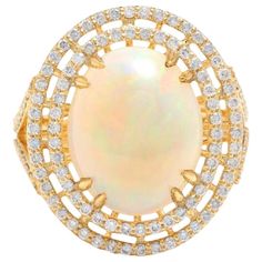 6.30 Carats Natural Impressive Ethiopian Opal and Diamond 14K Solid Yellow Gold Ring The opal has beautiful fire, pictures don't show the whole beauty of the opal! Suggested Replacement Value: Approx. $7,200.00 Total Natural Opal Weight is: Approx. 5.40 Carats Opal Measures: Approx. 15.20 x 12.20mm Total Natural Round Diamonds Weight: Approx. 0.90 Carats (color G-H / Clarity SI1-SI2) Ring size: 7 (we offer free re-sizing upon request) Ring total weight: Approx. 8.3 grams Disclaimer: all weights, Emerald Cut Aquamarine Ring, Expensive Rings, Opal Band, Yellow Gold Diamond Ring, Emerald Cut Rings, 14k Gold Ring, Yellow Gold Ring, Natural Opal, Quality Diamonds