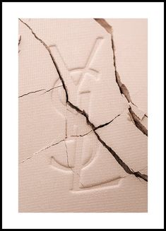 - Photograph with close up of a broken powder with the YSL logoClose up photograph of a YSL powder with cracks in it. The soft hues of beige and exclusive design makes this print perfect for the fashion-lover with a minimalistic interior style.  The poster is printed with a white border that nicely frames the design. Ysl Editorial, Prada Poster, Fashion Art Prints, Gallery Wall Inspiration, Interior Minimalista, Ysl Logo, Pink Posters, Logo Gallery, Gallery Wall Frames