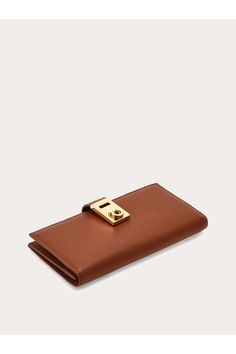 Shop the Hug continental wallet Cognac on Ferragamo.com. Discover the iconic collection on our official online shop now. Free Delivery. The Hug, Ash Grey, Salvatore Ferragamo, Continental Wallet, Cognac, Calf Skin, Slots, Zip Pockets, Free Delivery