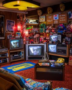 a living room filled with lots of different tvs