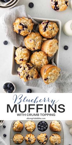 blueberry muffins with crumb topping on a plate next to other muffins