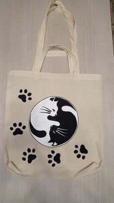 a bag with a cat and paw prints on it