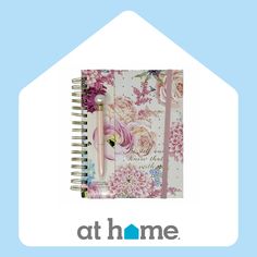 an open notebook with flowers on it and the words at home