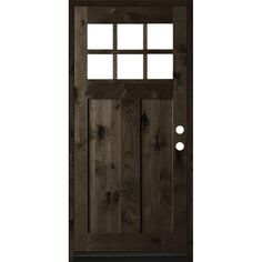 the front door is made from wood and has two glass panels on each side, with one