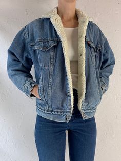 - Vintage 1980s Levis faux shearling lined denim jacket - Snaps up the front - Made in USA - Tagged L but fits womens XS Chest: 20.5" Length: 23" Sleeve: 19" Affordable Levi's Denim Blue Outerwear, Fleece Lined Denim Jacket Outfit, Cheap Levi's Long Sleeve Outerwear, Retro Medium Wash Outerwear For Winter, Retro Medium Wash Winter Outerwear, Retro Denim Blue Jacket For Winter, Winter Denim Jacket With Faux Fur Lining, Wool Jacket Outfit, Jean Jacket Outfit