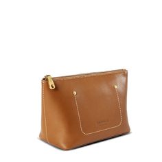 a brown leather purse with gold hardwares on the front and side, sitting on a white surface