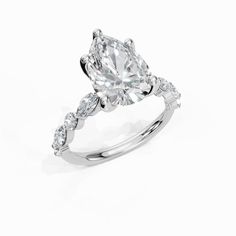 a diamond engagement ring on a white background