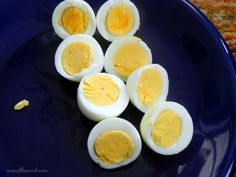 hard boiled eggs are arranged on a blue plate