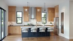 a kitchen with wooden cabinets and white stools next to an island in the middle