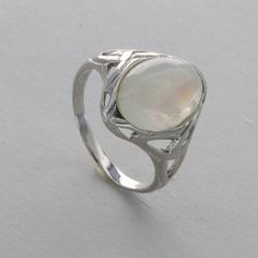 These is a beautiful pair of Sterling Silver R ing with a Rainbow Moonstone Gemstone. The ring are made out of solid 925 Silver and there is no nickel or other substances causing most allergies. This makes the ring hypo allergenic. Size of the Moonstone 1.4 x 1.1 cm or  0.55 x 0.43 inch Please note: Our jewelry is photographed close up to show detail and may appear larger than they are. We use a dime coin as size reference on one of the pictures. You will receive the item in a gift box - perfect Modern Oval Silver Gemstones, Classic Polished Moonstone Ring Gift, Fine Jewelry Polished Moonstone Ring For Anniversary, White Polished Moonstone Ring In Sterling Silver, Polished White Moonstone Ring In Sterling Silver, Fine Jewelry Moonstone Ring For Anniversary With Polished Finish, Polished Moonstone Ring With Round Stone For Anniversary, White Moonstone Ring With Polished Sterling Silver, Elegant Opal Ring With Large Stone