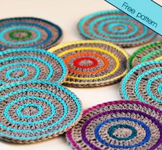 crocheted coasters with colorful circles on them