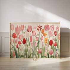 a painting with flowers painted on it in an empty room