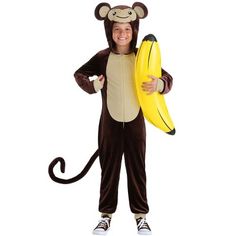 a boy in a monkey costume holding a banana