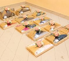 there are many boxes with flowers on them sitting on the floor next to each other