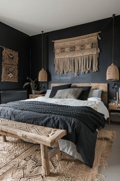 a large bed sitting next to a wooden bench