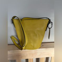 Brand New Saffron Yellow Coach Crossbody Bucket Purse Yellow Bucket Bag With Detachable Handle, Chic Yellow Coach Shoulder Bag, Elegant Yellow Coach Shoulder Bag, Elegant Yellow Bucket Bag For Daily Use, Yellow Crossbody Bucket Bag With Detachable Strap, Elegant Yellow Bucket Bag With Removable Pouch, Elegant Yellow Bucket Bag With Adjustable Strap, Elegant Yellow Bucket Bag, Yellow Leather Coach Shoulder Bag