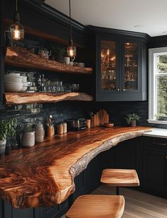 a wooden counter top in a kitchen next to a window