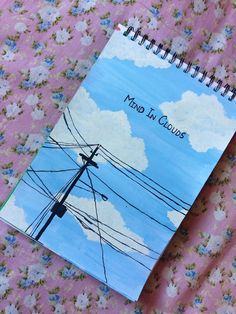 a notebook with the words mind in clouds on it