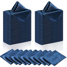 blue napkins are folded in front of each other and placed on top of each other