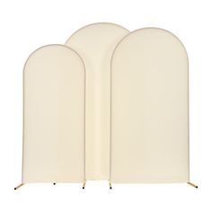 three white archs with gold legs on a white background, set against a white backdrop