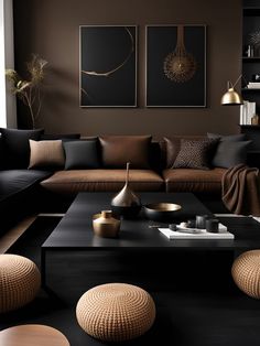 a living room filled with black furniture and lots of brown pillows on top of it