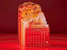 a red and yellow clock on top of a table