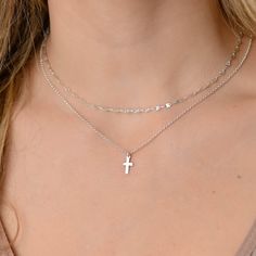 This layered silver cross necklace is a set of 2. The chains are solid sterling silver 925. They have an extension so that the size can be adjusted. The one necklace is a plain chain while the other has a small cross on it. Cross Necklace Layering, Silver Necklace Stack Dainty, Dainty Silver Crucifix Necklace, Silver Necklace With Delicate Chain And Cross Pendant, Silver Cross Necklace With Delicate Chain, Silver Sterling Cross Necklace With Delicate Chain, Sterling Silver Cross Necklace With Delicate Chain, Silver Charm Necklace With Cross Pendant And Delicate Chain, Silver Charm Necklace With Cross Pendant