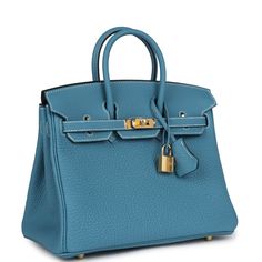 This Birkin is in Blue Jean togo leather with gold hardware and has contrast stitching, a front flap, two straps with center toggle closure, clochette with lock and two keys, and double rolled handles.The interior is lined with Blue Jean chevre, has one zip pocket with an Hermes engraved zipper pull and an open pocket on the opposite side.Collection: WOrigin: FranceCondition: New and never worn (plastic on hardware)Accompanied by: Hermes box, Hermes dustbag, clochette, clochette dustbag, lock, keys, felt, carebookMeasurements: 10" width x 7.5" height x 4.75" depth; 2.75" handle drop Blue Leather Bag With Lock, Blue Travel Bag With Turn-lock Closure, Blue Everyday Bag With Lock, Blue Office Bag With Turn-lock Closure, Blue Bags With Lock For Formal Occasions, Blue Leather Bag With Turn-lock Closure, Blue Epsom Leather Bag With Gold-tone Hardware, Timeless Blue Bags With Silver-tone Hardware, Classic Blue Bags With Metal Hardware